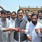 Chairman Senate Syed Yousaf Raza Gillani cutting ribbon to inaugurate a restaurant