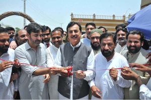Chairman Senate Syed Yousaf Raza Gillani cutting ribbon to inaugurate a restaurant