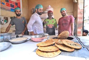 On the second day of Eid-ul-Adha, tandoori meat vendors are preparing Naan (qeeme wale) at Khuda Bakhsh Road. People eagerly eat sacrificial meat made naan.