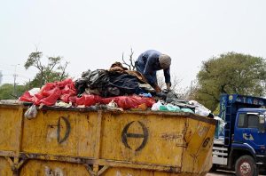 A gypsy man collects valuables from garbage near the Khanna Pul area.
