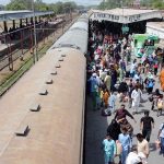 A large number of people are standing at Railway Station to go to their duties after spending the Eid ul-Adha holidays