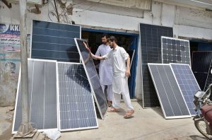 Vendors displays solar panels outside their shop to attract the customer at Station Road.