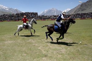 Chitral and Gilgit polo teams in action during Three-day Shandur Polo Festival 2025 at Shandur Polo ground.