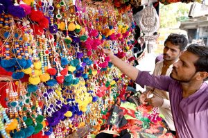 People purchasing Ashura related stuffs to be used during the mourning procession in Muharram ul Harram.