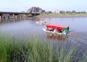 Visitors enjoy swing on merry-go round on 3rd day of Eid Ul Azha celebrations at River Chenab Park