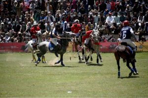 Chitral and Gilgit polo teams in action during Three-day Shandur Polo Festival 2025 at Shandur Polo ground.