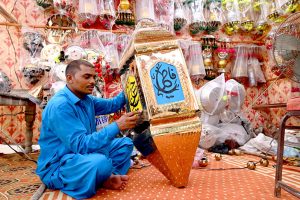 People purchasing Ashura related stuffs to be used during the mourning procession in Muharram ul Harram.