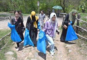 Students busy in picking garbage during launching ceremony of the Clean-up Drive Initiative at the Margallah Hills, National Park and Trail 5