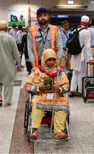 Provincial Health Minister Khawaja Imran Nazir welcomes the pilgrims of the first Hajj flight at the airport