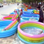 A vendor displaying the water-pools to attract the customers outside Thandi sarak