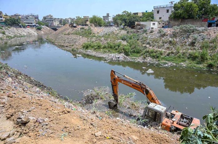 Heavy machinery is being used to remove garbage from Nullah Lai as part of a cleanup operation ahead of the upcoming monsoon season