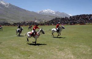 Chitral and Gilgit polo teams in action during Three-day Shandur Polo Festival 2025 at Shandur Polo ground.