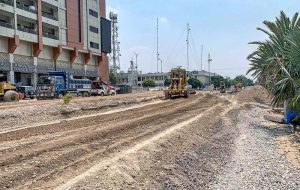 A labourer busy giving finishing touches to the wall at the under-construction underpass site in Saddar Cantt in twin cities