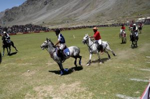 Chitral and Gilgit polo teams in action during Three-day Shandur Polo Festival 2025 at Shandur Polo ground.
