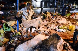 People curing animal hides after collecting on the 3rd day of Eid Ul Azha at his workplace near Old Fish Market