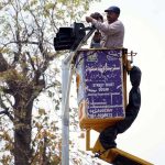 TMA workers are busy repairing the traffic signal at the University Chowk
