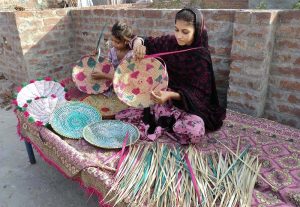 Young girls are busy preparing household items for sale to earn a livelihood