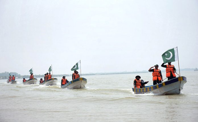 Rescue 1122 personnel perform life-saving drills during a pre flood mock exercise in Chenab River