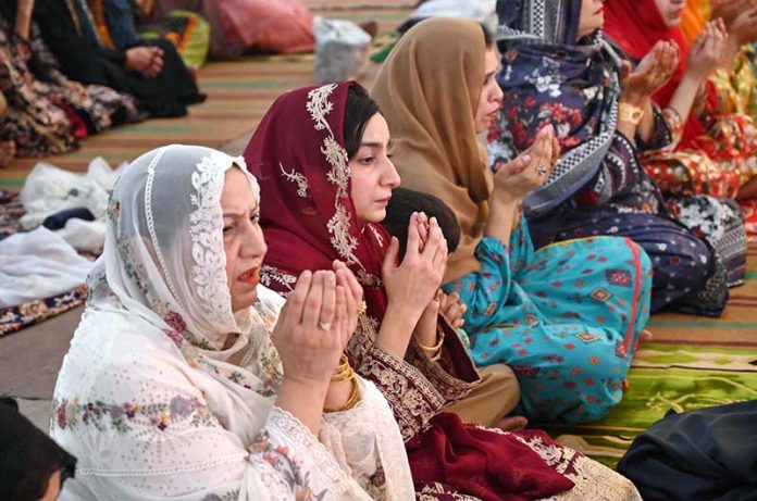 Women offering dua after Eidul Azha prayers at historic Badshahi Masjid