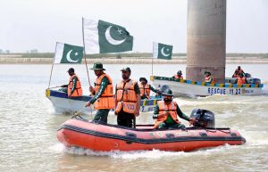 Rescue 1122 personnel perform life-saving drills during a pre flood mock exercise in Chenab River