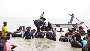 Large number of people enjoy bathing to get relief from scorching hot weather at Keenjhar Lake.