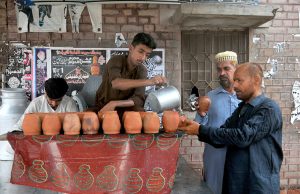 Volunteers serving Sabeel in the first decad of Muharram Ul Haram at Shah Shams.
