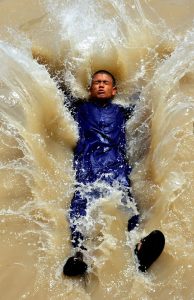 Youngsters beat the scorching heat by diving into a canal, turning the sweltering weather into a moment of joy and relief