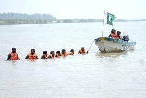 Rescue 1122 personnel perform life-saving drills during a pre flood mock exercise in Chenab River