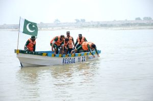 Rescue 1122 personnel perform life-saving drills during a pre flood mock exercise in Chenab River