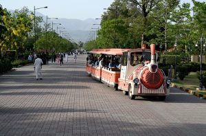 Children enjoy swing on the merry go round during their visit to Lake View Park on the second day of Eid-ul-Azha celebrations.
