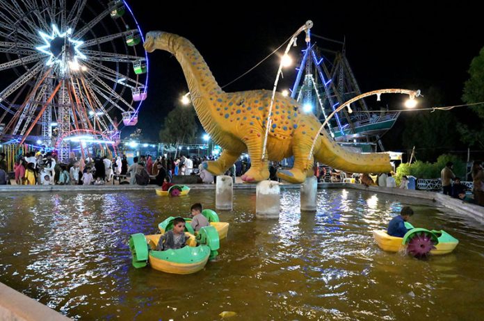 Children enjoying boat riding at Rani bagh Funland