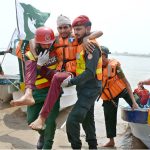 Rescue 1122 personnel perform life-saving drills during a pre flood mock exercise in Chenab River