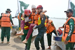 Rescue 1122 personnel perform life-saving drills during a pre flood mock exercise in Chenab River