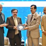 Chairman Senate of Pakistan, Syed Yousuf Raza Gillani, presents a shield to Governor of Balochistan Sheikh Jaffar Khan Mandokhail during the seminar on "Faculty Leadership & Management Excellence (FLAME) 2025", organized by the Higher Education Commission (HEC) at a local hotel