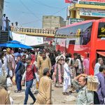 A large number of people arrive at Pirwadai Bus Stand to depart for their hometowns to celebrate upcoming Eidul Azha with their families