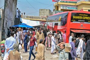 A large number of people arrive at Pirwadai Bus Stand to depart for their hometowns to celebrate upcoming Eidul Azha with their families