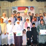 Provincial Minister for Agriculture and Livestock Syed Ashiq Kirmani in a group photo with farmers after handing over green tractor documents to farmers during a ceremony under CM Punjab’s Agricultural Support Initiative at a local hall.