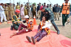 Rescue 1122 personnel perform life-saving drills during a pre flood mock exercise in Chenab River