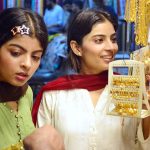 Girls busy in selecting and purchasing artificial jewelry from stall for preparation of upcoming Eid-ul-Azha in a local market