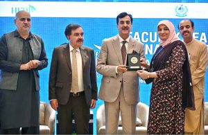 Chairman Senate of Pakistan, Syed Yousuf Raza Gillani, presents a shield to Governor of Balochistan Sheikh Jaffar Khan Mandokhail during the seminar on "Faculty Leadership & Management Excellence (FLAME) 2025", organized by the Higher Education Commission (HEC) at a local hotel