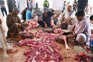 Butchers slaughtering sacrificial animals at Jamia Naeemia on the 1st day of Eidul Azha