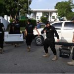 Pakistan’s Federal Board of Revenue (FBR) officials shift boxes with copies of the 2025–26 fiscal budget outside the Parliament House, before the start of the budget session