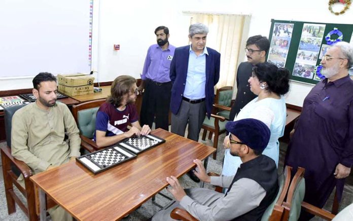 Federal Secretary for Education and Professional Training Nadeem Mehboob visiting summer camp held at National Institute of Special Education