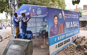 WASA staff set up an emergency camp to drain monsoon rainwater from the road at Justice Cornelius Chowk, McLeod Road.