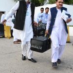 Pakistan’s Federal Board of Revenue (FBR) officials shift boxes with copies of the 2025–26 fiscal budget outside the Parliament House, before the start of the budget session