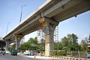 PHA workers repaint and clean the Metro Bus track to enhance the beauty of twin cities