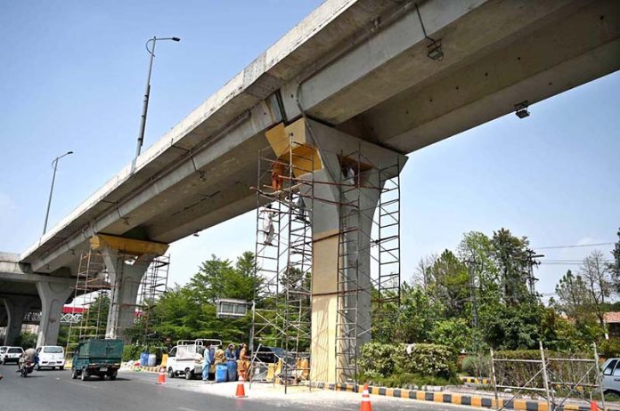PHA workers repaint and clean the Metro Bus track to enhance the beauty of twin cities