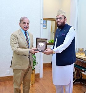 Prime Minister Muhammad Shehbaz Sharif presenting a shield to Federal Minister for Religious Affairs Sardar Muhammad Yousaf to recognize his services for making best arrangements for Hajj 2025