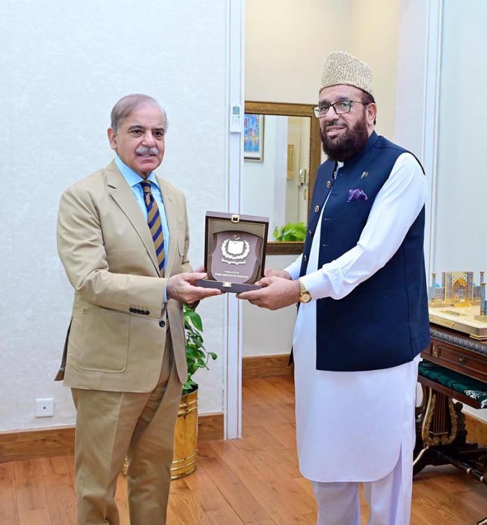 Prime Minister Muhammad Shehbaz Sharif presenting a shield to Federal Minister for Religious Affairs Sardar Muhammad Yousaf to recognize his services for making best arrangements for Hajj 2025