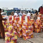 A large number of people purchasing fruits displayed by vendors at Fruit and Vegetable Market in the Federal Capital.